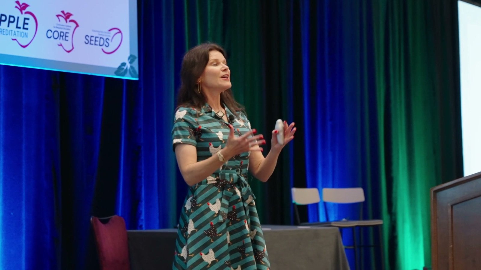 A speaker on stage at the FACCM and APPLE annual conference